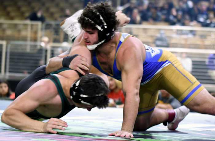 Miami South Dade junior Sawyer Bartelt roars to his third-straight championship during the 220-pound title match against Saint Vincent Saint Mary (Ohio) senior Bryson Getz at the 2023 Knockout Christmas Classic in December at Silver Spurs Arena in Kissimmee.